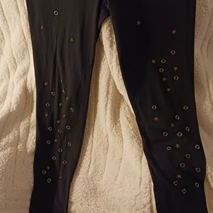RUE 21 Black Legging embellished with rustic gold stars and circles.